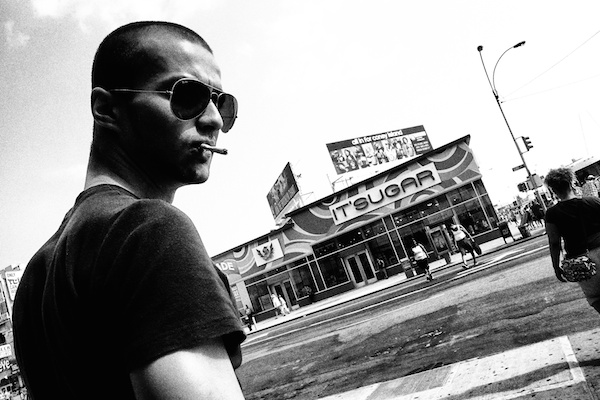 black and white image of a man smoking