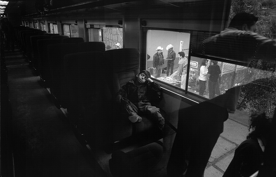 black and white image of boy sleeping