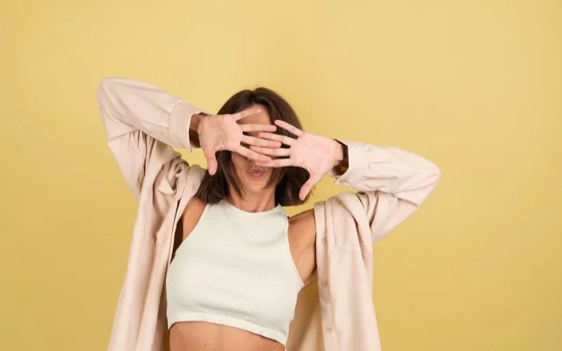 model With Hair Covering Face Pose