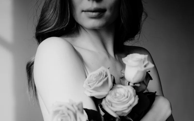 black and white photo of a naked women posing