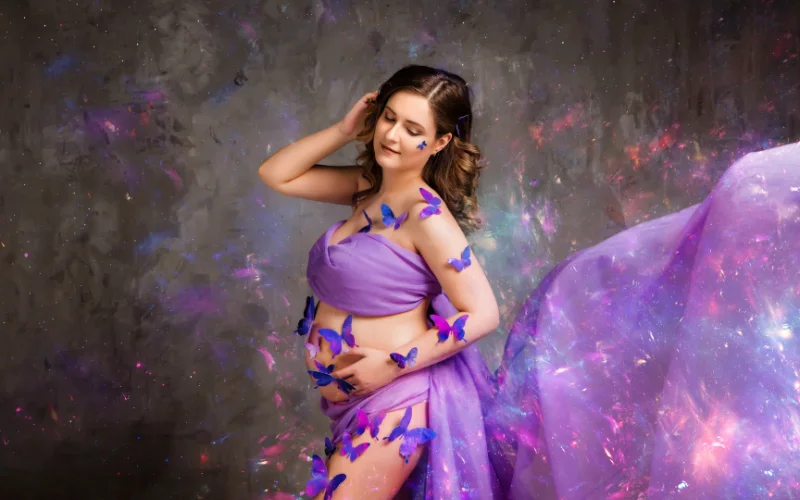 maternity shoot with woman wearing glitter and stickers