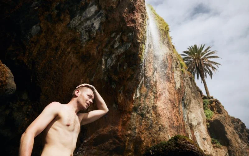 use of hands male nude pose