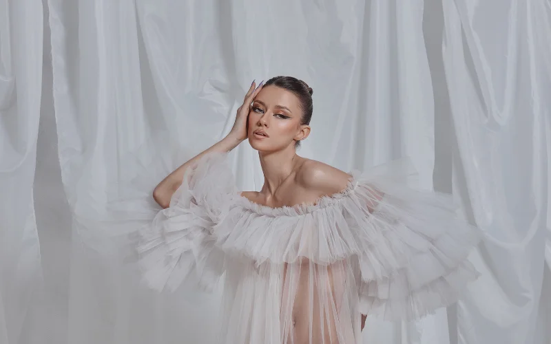 woman in a see through cape - boudoir photoshoot outfit