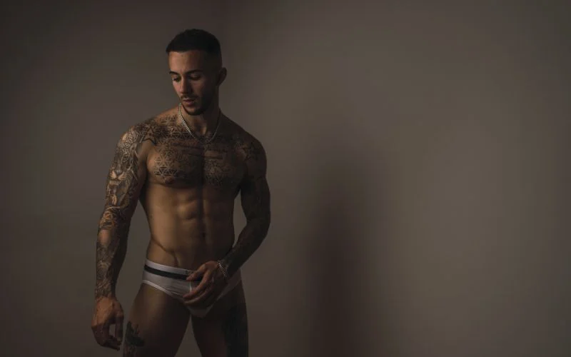 flexing male boudoir photography