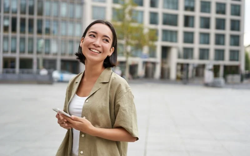 street portrait photography of a young woman smiling