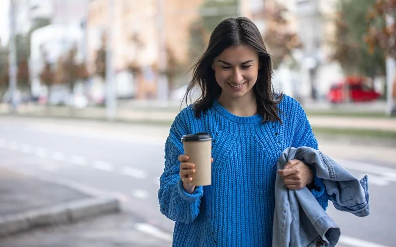 candid portrait of a woman wearing blue sweater