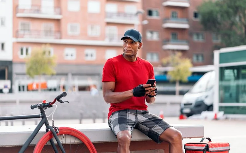 healthy and fit man sitting on bench