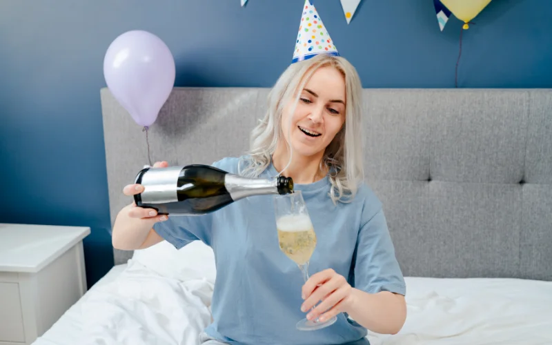 bedroom photoshoot poses with champagne, instagram bedroom photoshoot ideas