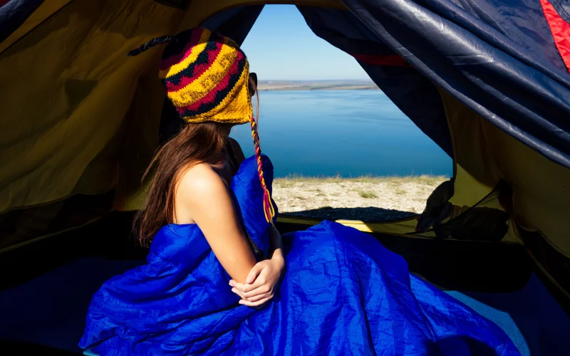 nude campsites - woman nude in a tent