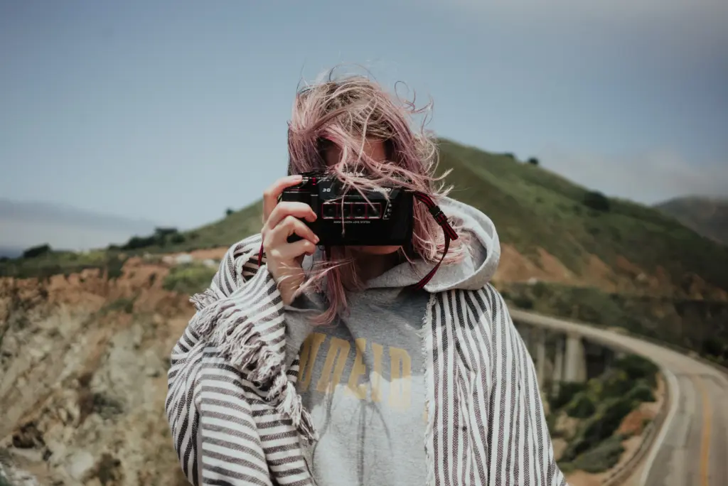 Girl clicking road trip photos