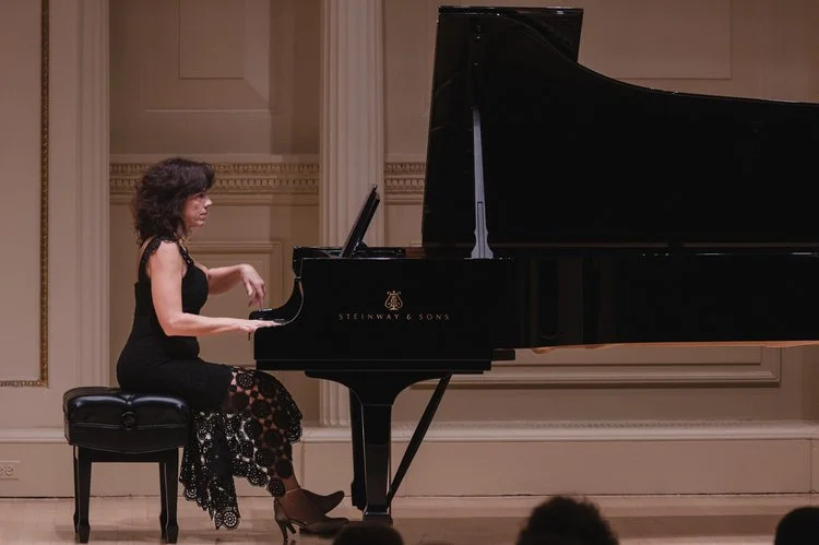 Women playing piano captured by performing arts photographer