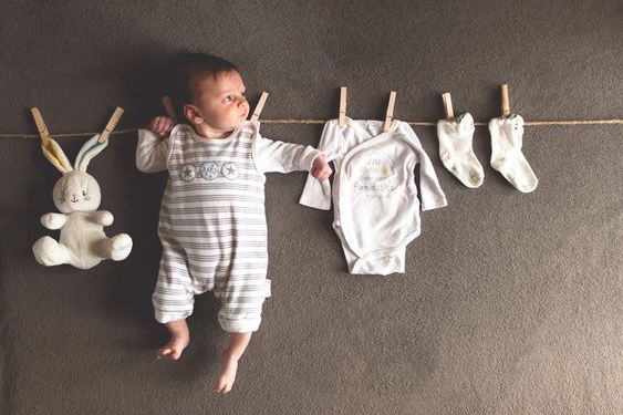 Newborn posing with props