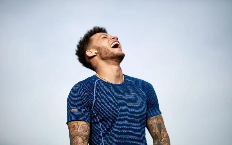 a young man laughing out loud