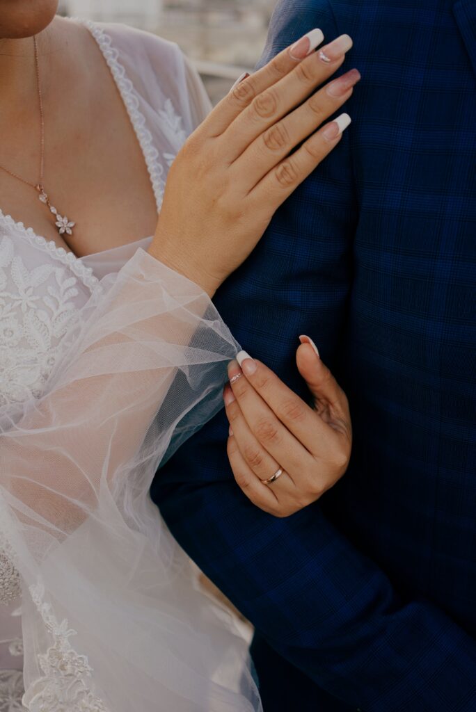 Woman holding a mans arm