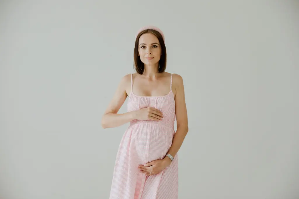 women giving pregnancy photoshoot poses