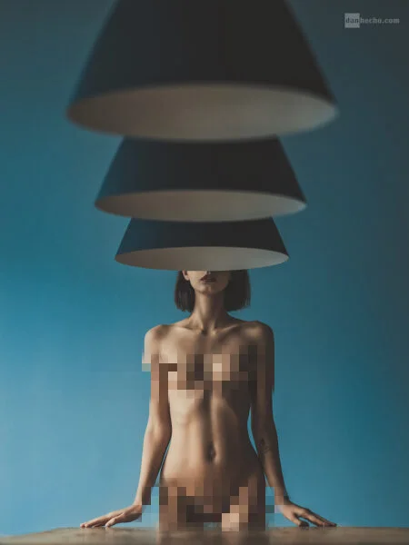 Nude model hiding face