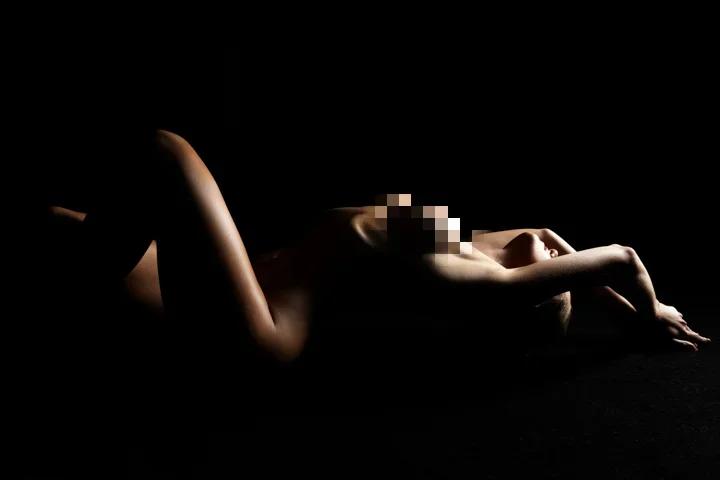 nude model lying on the floor pose