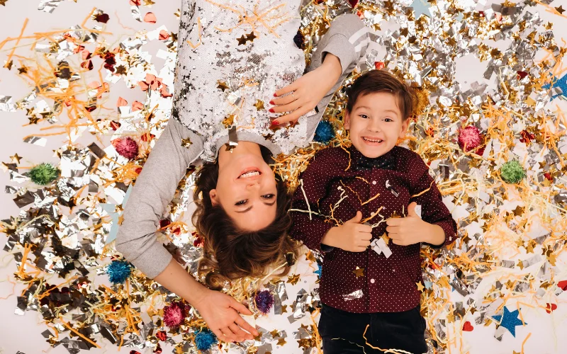 Posing with tinsels at holiday photoshoot