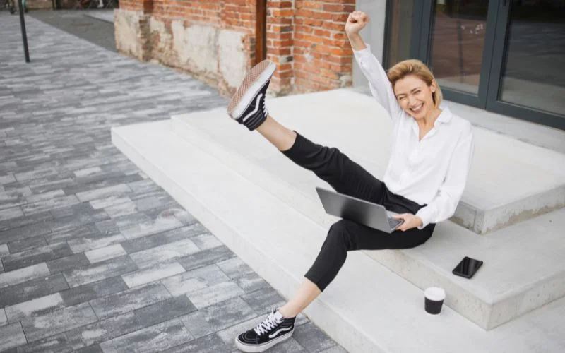 sitting down and kicking pose