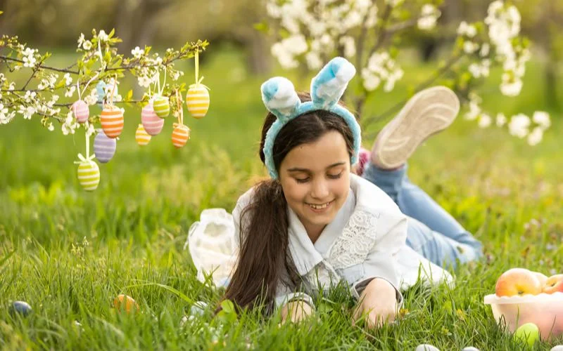 kid playing in garden on easter