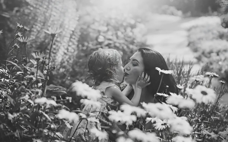 Baby kissing mother preview