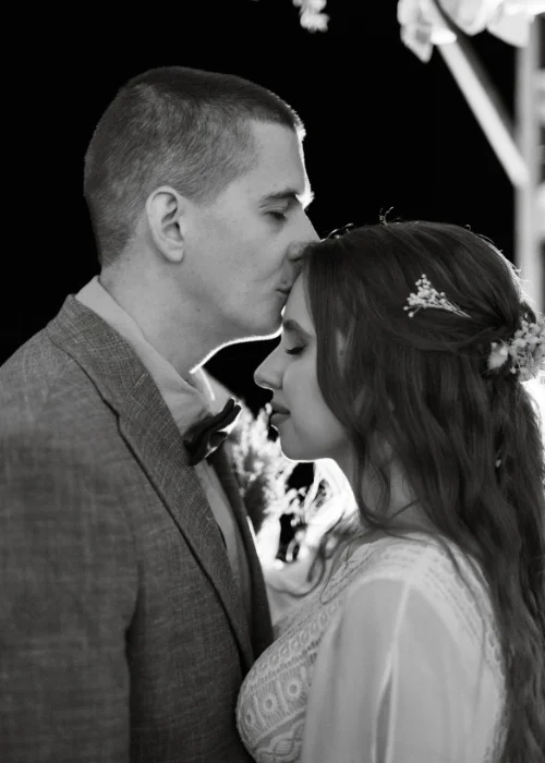 The forehead kiss pose