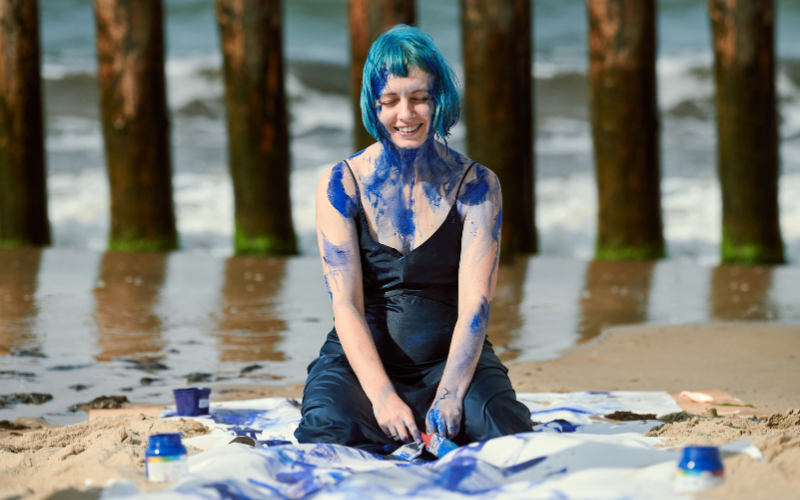 divorce photoshoot outfit ideas - paint fight in a wedding dress