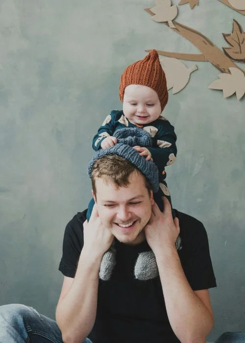 studio portraits of father and baby