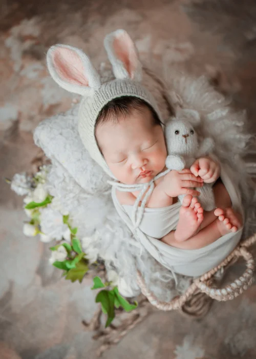 a cute newborn baby dressed up as a bunny