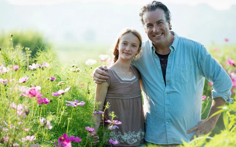 father and daughter photoshoot in a flower field