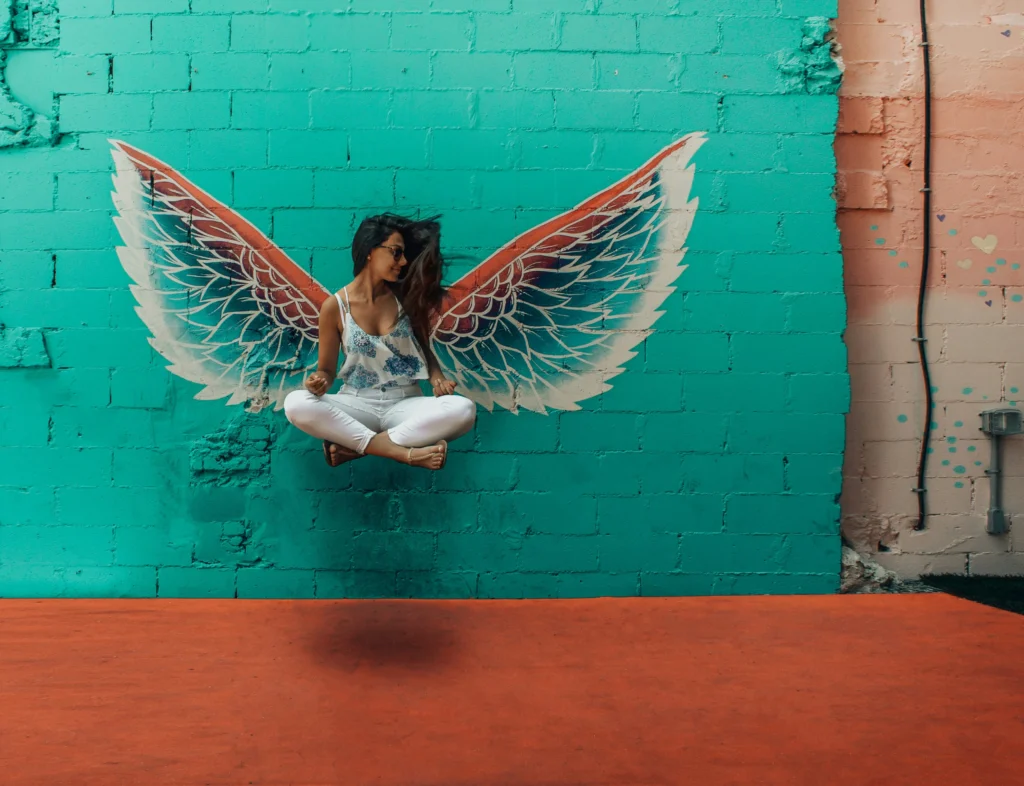 a woman posing with angel wings