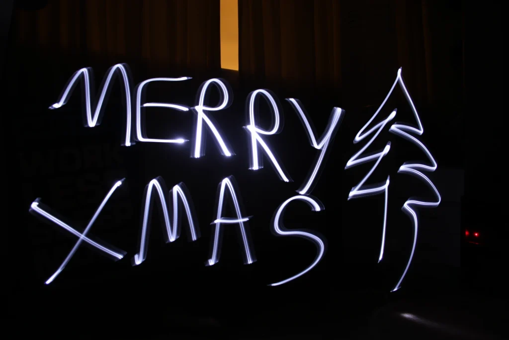 Merry Christmas message light painting photography with torch