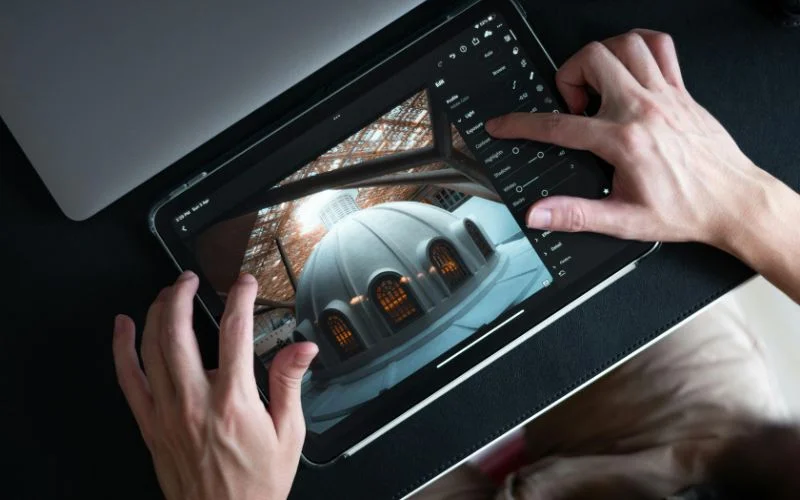 person working on ipad