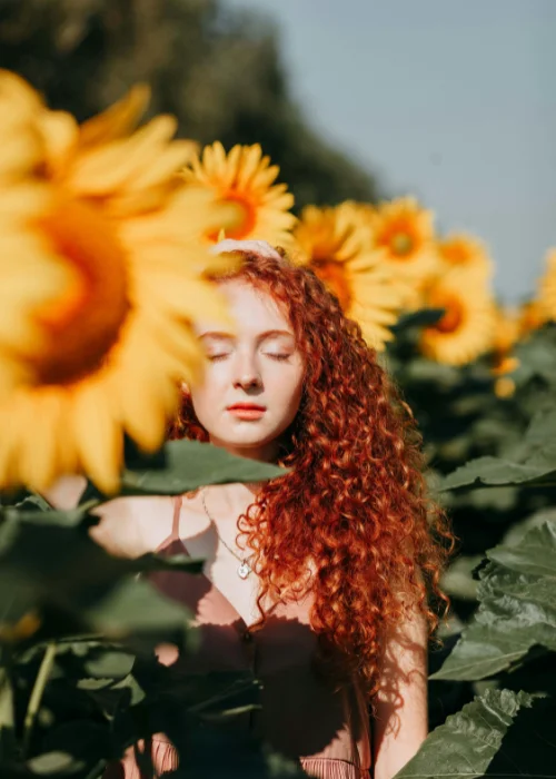 a girl posing in the sunflower field