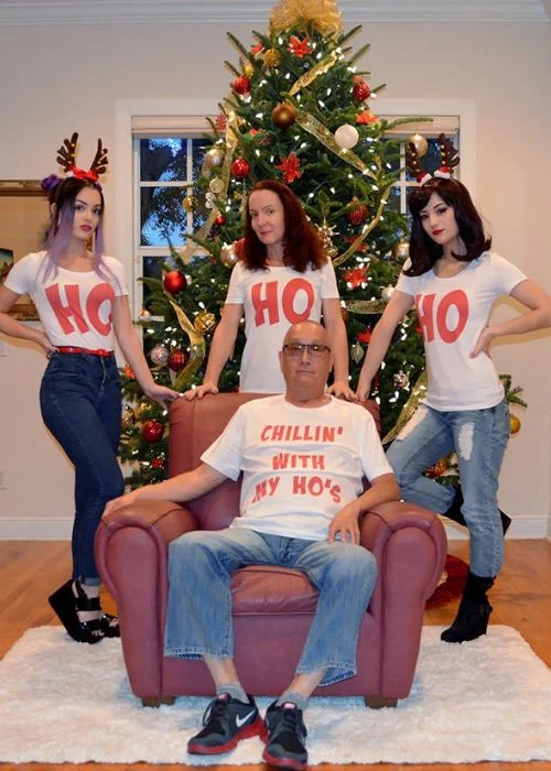 image of a dad with his wife and daughters