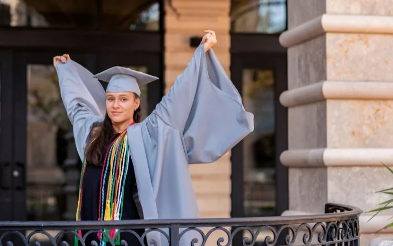 graduation photo poses with open coat