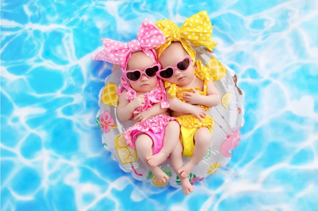 twins posing on a floatie