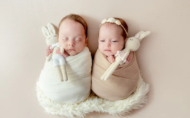twins in matching swaddles - newborn twin photography ideas
