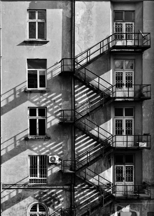 a photo of staircases and windows on a building - unity in photography examples