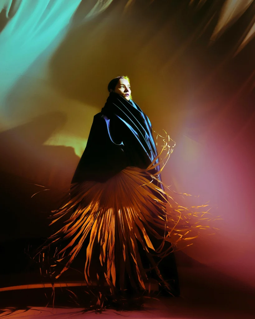 photo of a model standing in colored light - unity in photography examples
