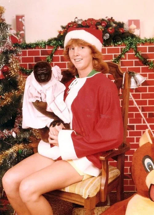 lady with a monkey dressed in pink