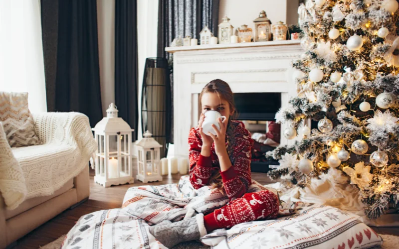 a woman in PJs sipping eggnog