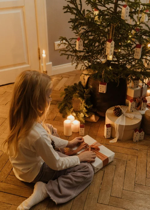 Christmas tree family photo ideas while opening presents