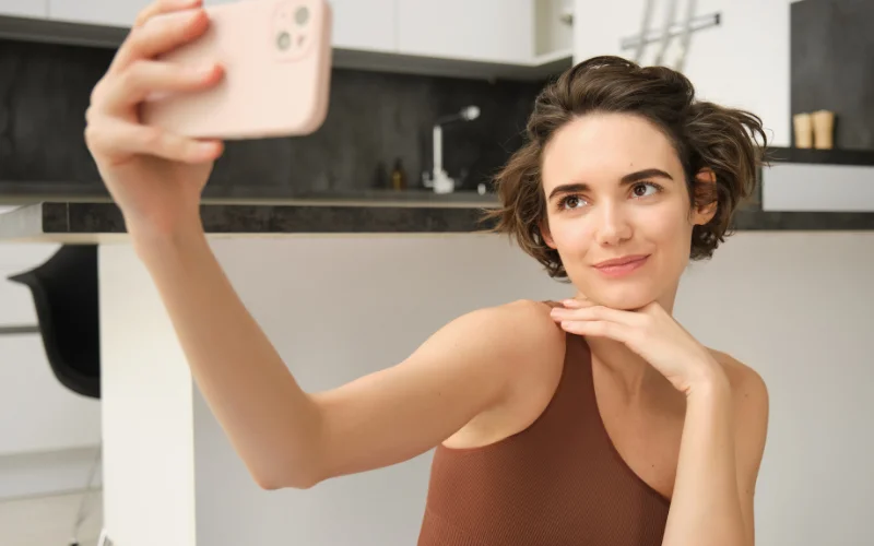 One of the best selfie poses to highlight your natural charm with a stylish and flattering angle.