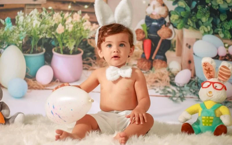 photo of a baby wearing bunny ears and bowtie, easter infant photo ideas for festive season