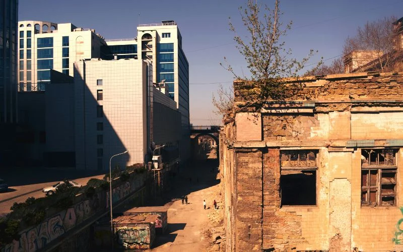 image showing a contrast of old building and new building to create a visual storytelling effect