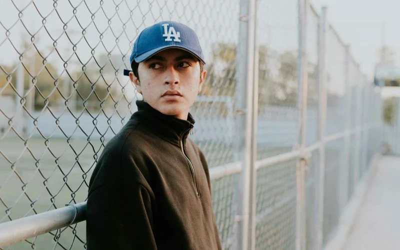 senior portrait ideas near chainlink fences