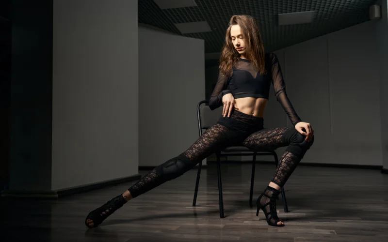 sitting with wide legs fashion pose